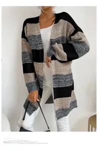 Detailed knit texture of a long oversized striped cardigan in black beige and grey