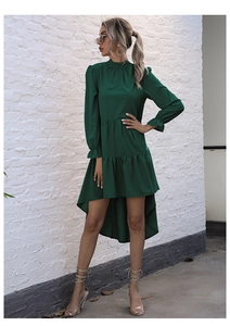 Detail of high-low tiered hem and ruffled cuffs on this dark green long sleeve dress