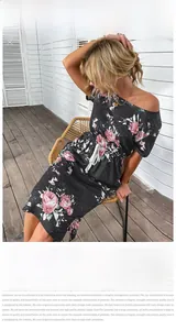 Vue détaillée de la robe d'été noire à épaules dénudées avec imprimé rose et cordon à la taille