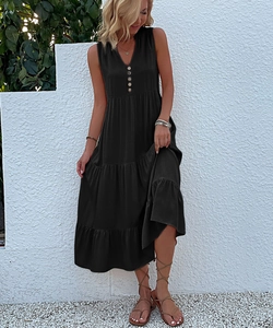 Detail of black V-neck sleeveless maxi dress with four vintage buttons and tiered ruffles