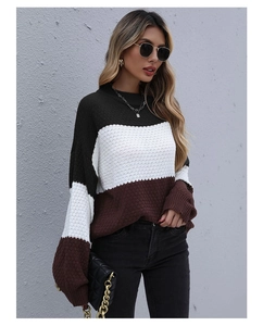 Detail of a color-block honeycomb knit sweater with wide horizontal stripes