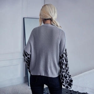 Women's grey knit cardigan with leopard print patchwork sleeves and ribbed trim details
