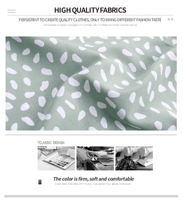 Detailed view of light green polka dot fabric texture with soft and durable textile finish
