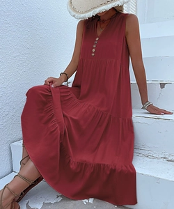 Detailed view of dark red tiered maxi dress with button-up V-neck and sleeveless design
