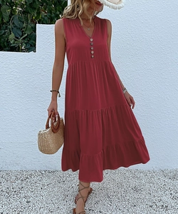 Detail of burgundy V-neck sleeveless maxi dress with buttons for summer beach vacation