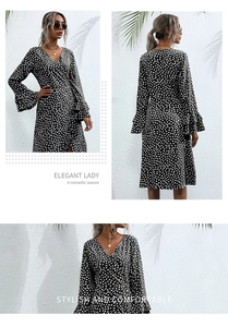 Detail of V-neck floral black dress with elegant ruffle cuffs and long sleeves