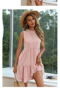 Detail of pink floral sleeveless summer dress featuring ruffled neck and layered hem