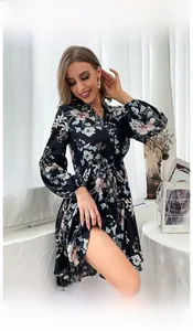 Detailed view of black floral long sleeve dress with V-neck and button details