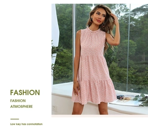 Detail of floral tiered summer dress with ruffle neckline and pink flower print