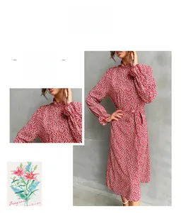 Detail of red floral midi dress with a high ruffle neck and matching waist tie belt