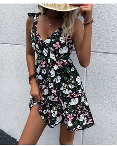 Detail of floral print summer dress with tie straps and ruffled hem design