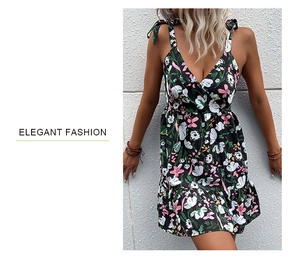 Close-up of floral print summer dress with elegant V-neckline and tie straps detail