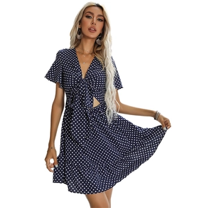 French style V-neck navy blue polka dot dress with waist cutouts and ruffle sleeves