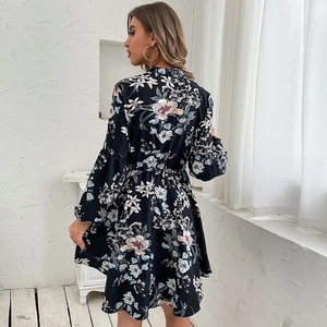 Elegant black floral long sleeve dress with high waist and A-line skirt silhouette
