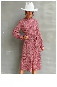 Floral red dress detail with ruffle stand collar and elastic cuffs for elegant style