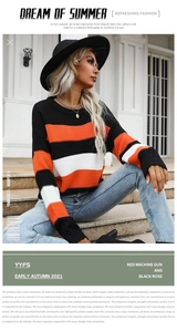 Detail of a casual long-sleeve knit sweater with bold orange, black, and white stripes