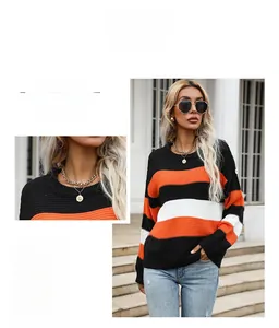 Detail of the crew neck collar and textured stripe knit fabric on this women sweater