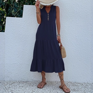 Navy blue sleeveless tiered midi dress with V-neck button detail for summer resort style