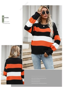 Detail of multi-color striped knit sweater with round neck and high-quality texture