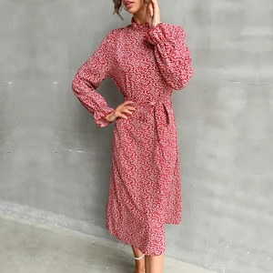 Elegant red ditsy floral midi dress with high neck, long sleeves, and belted waist tie