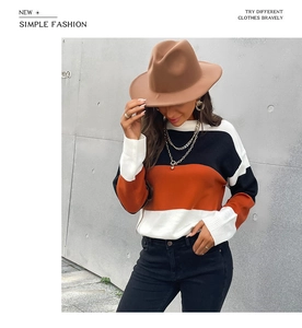 Vue détaillée d'un pull en maille à rayures color-block avec une texture de haute qualité