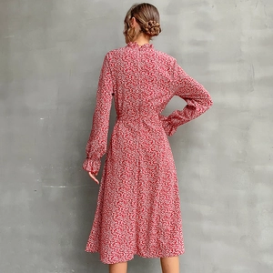 Elegant red floral long sleeve midi dress with a mock neck and ruffle cuffs