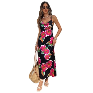 Women's summer backless floral maxi dress with pink blossoms on a black background