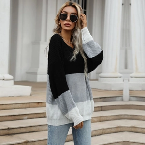 Loose color-block knit sweater in black, grey, and white with ribbed cuffs for women