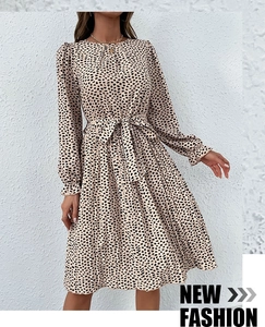 Close-up of leopard print dress detailing ruffled elastic cuffs and a waist tie belt