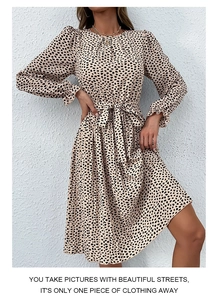 Close-up of leopard print long-sleeve dress with elegant waist tie and ruffle cuffs