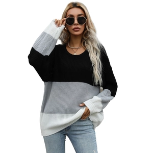 Women's oversize color-block crewneck knit sweater in black, gray, and white stripes