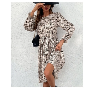 Detail of long sleeve dress featuring elastic frill cuffs and matching waist tie belt