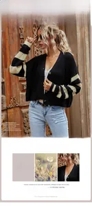 Detail of black knit cardigan featuring beige sleeve stripes and textured knit fabric