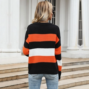 Women's casual loose knit sweater with tri-color stripes and shoulder button accents