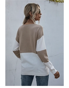 Back view of a khaki and white color-block knit sweater with ribbed cuffs and hem