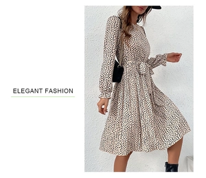 Detail of the elegant leopard print long sleeve dress with waist tie and pleated hemline
