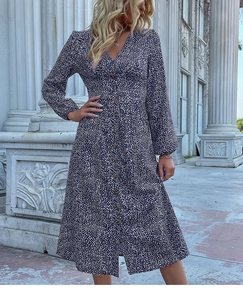 Detail of V-neckline and button-down front on a navy blue floral long sleeve midi dress
