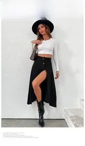 Detailed view of high waisted black skirt featuring a button front and waist belt design