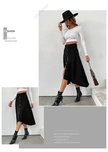 Detail of high waist black A-line skirt with single-breasted buttons and irregular hem