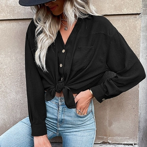 Women's black long sleeve button-up shirt with trendy front tie detail and V-neckline