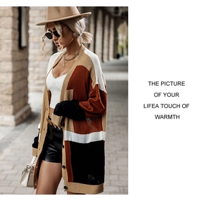Detailed close-up of color-block knit cardigan with brown, beige and black panels