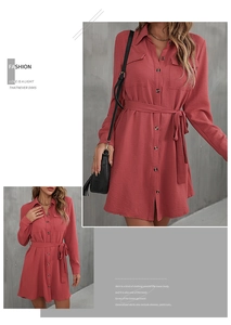 Close-up of red long sleeve shirt dress showing fabric texture, collar and pockets