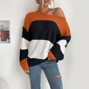 Loose women's striped knit sweater in orange, black and white color block style