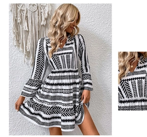 Close-up of bohemian V-neck dress with black and white tribal prints and layered skirt