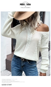 Detailed cable knit texture and hollow-out design of the cream white pullover sweater