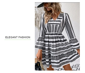 Detail of V-neck ruffled sleeves and geometric stripe print on a bohemian dress
