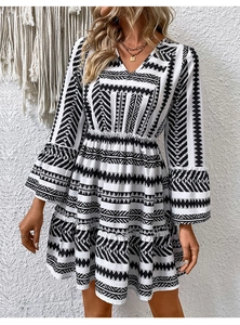 Detail view of V-neck and black and white geometric ethnic print on boho dress