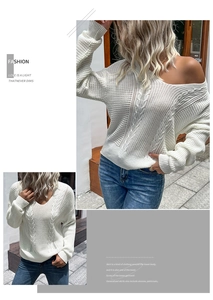 Detailed view of white chunky cable knit sweater with a V-neck and casual loose fit