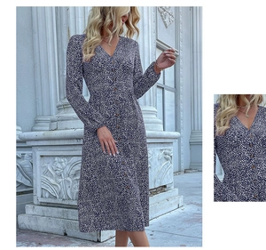 Detail view of V-neckline and button-down bodice on navy blue polka dot maxi dress