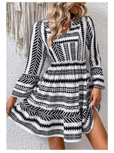 Detail of V-neck ruffled sleeve dress with black and white bohemian geometric print